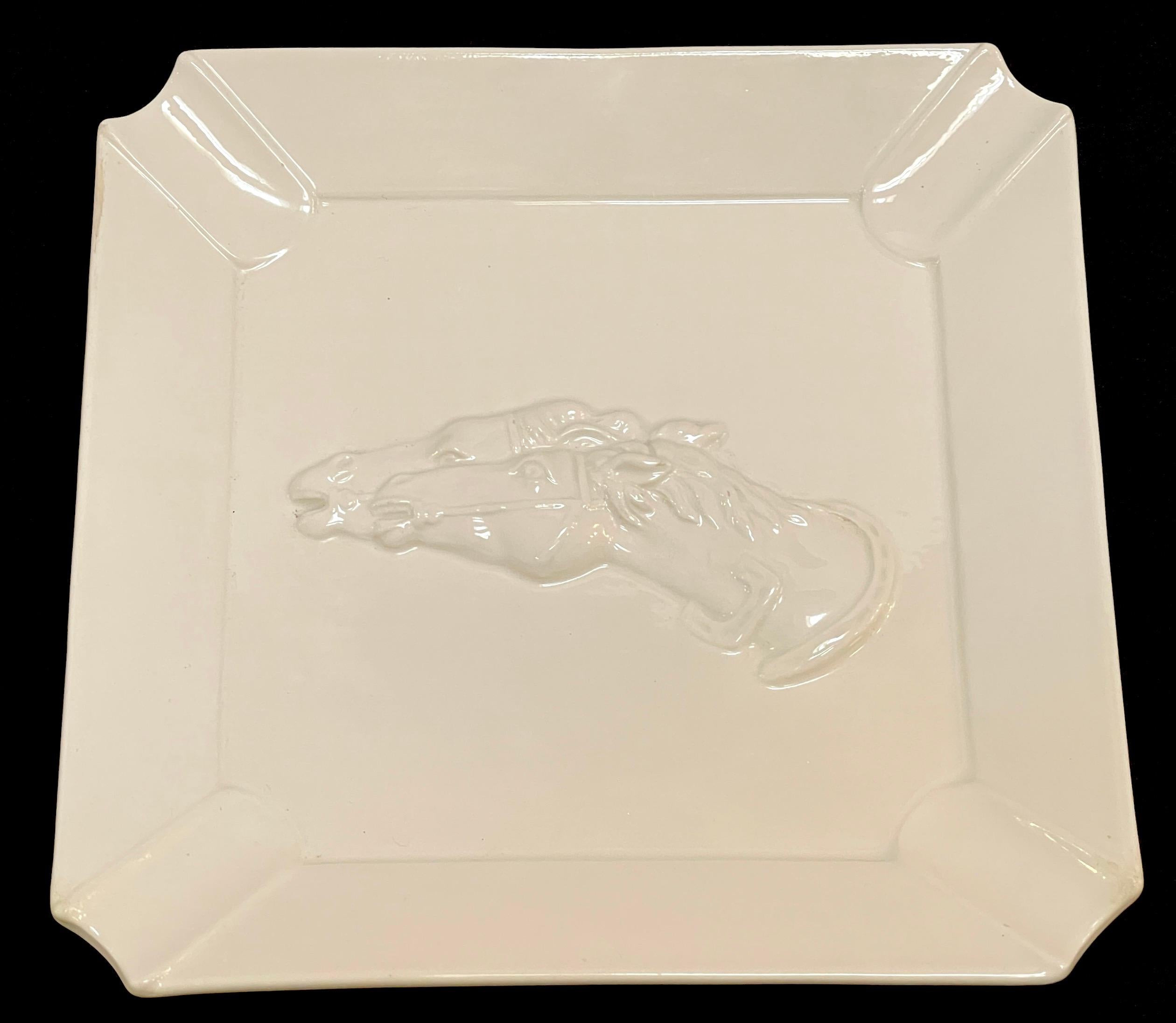 Gucci Blanc de Chine Porcelain Horse Motif Ash/Cigar Tray/ Vide-Poche 
Italy, Circa 1990s

A stunning piece from the 1990s, this Gucci Blanc de Chine porcelain tray features a horse motif and serves as a versatile accessory, functioning as an