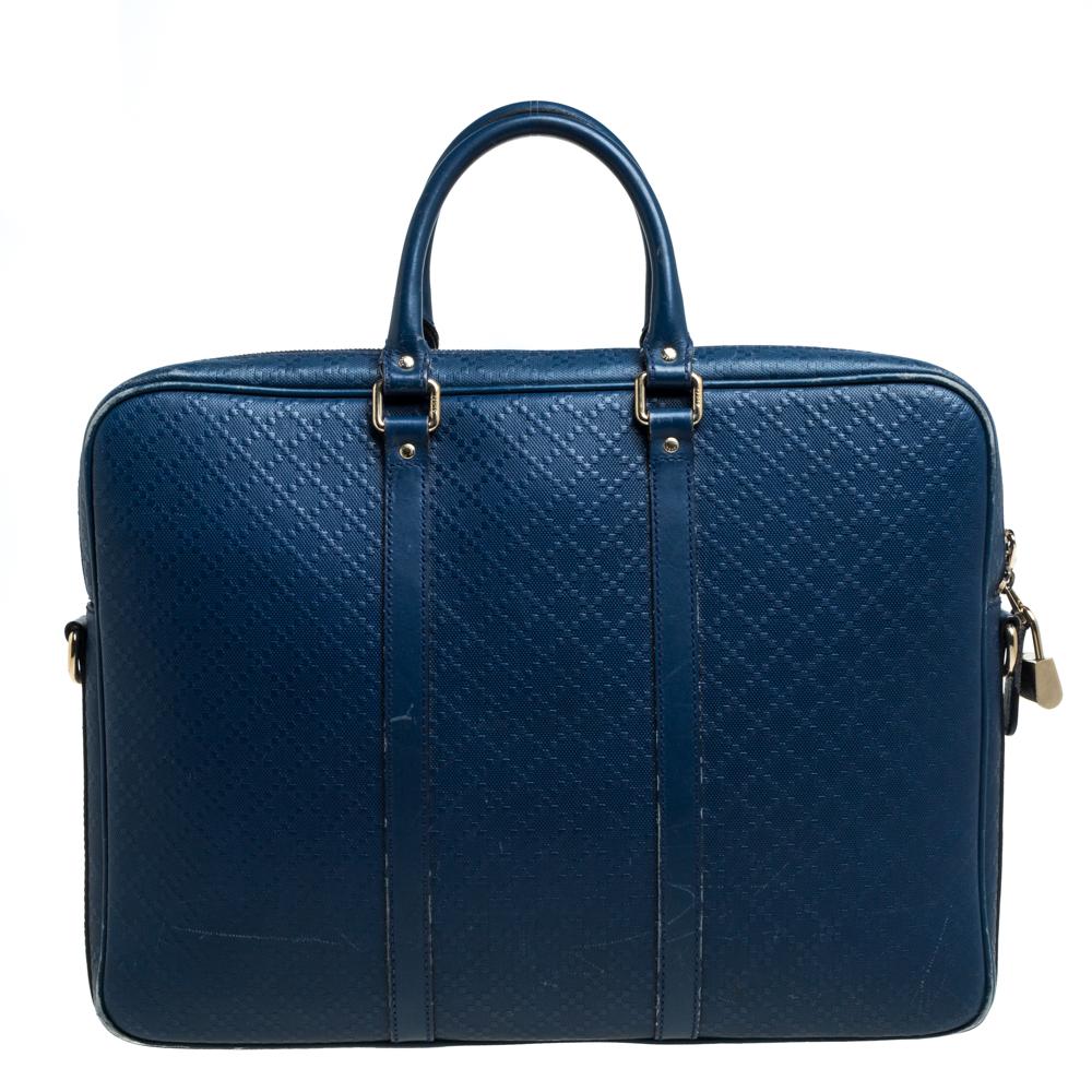 Designed in blue-hued leather, featuring the signature Diamante pattern throughout the exterior, this multi-functional briefcase from Gucci is smart and stylish. The zip fastenings on the top open to functional insides with enough space for all your