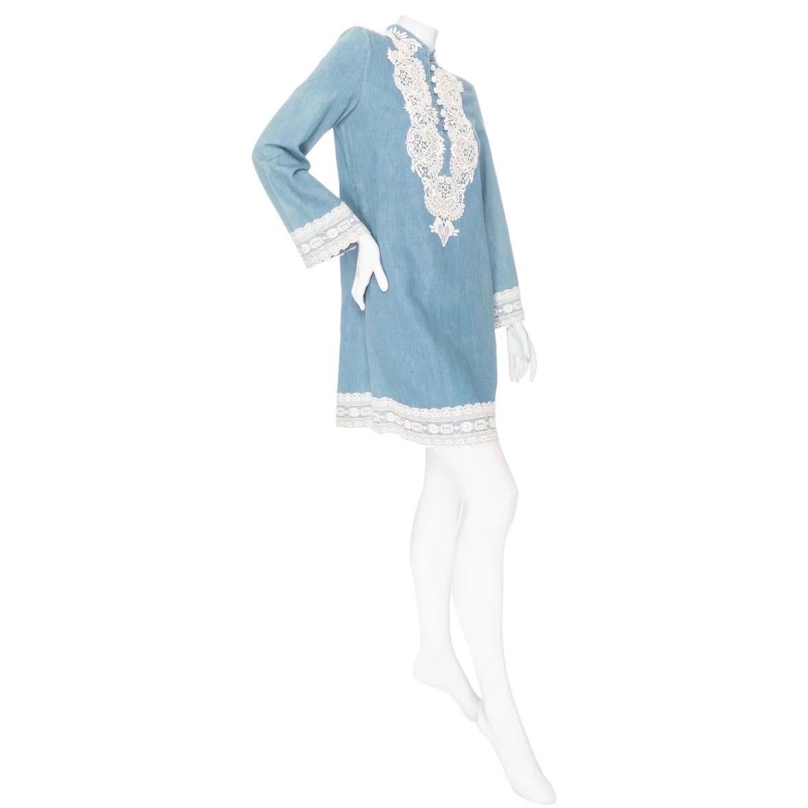 Gucci Blue Cotton-Linen Chambray and Lace Tunic Dress 

Blue/White
Chambray fabric
Lace appliqué trim
Long bell sleeves
Tunic neckline with button fastening
Shift silhouette
Mini length
Made in Italy
65% cotton, 35% linen fabric, 76% cotton, 24%