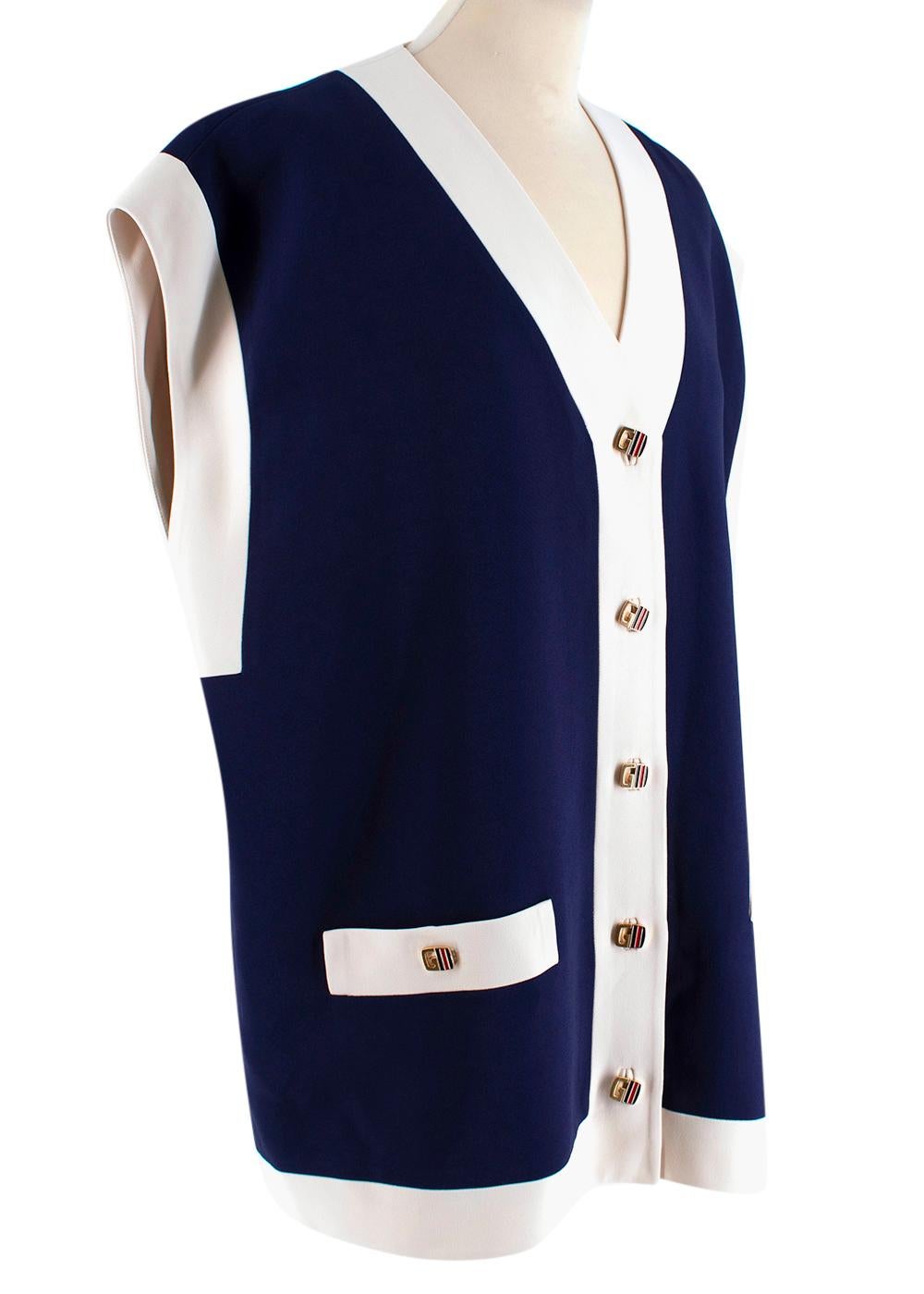 Gucci Blue Crepe Oversized Cady Vest

This blue and white woven vest has all the vintage feels and incorporates the iconic G logo with the signature blue and red Web enamel detailing to the button fastenings. Bringing old into the new. Featuring a