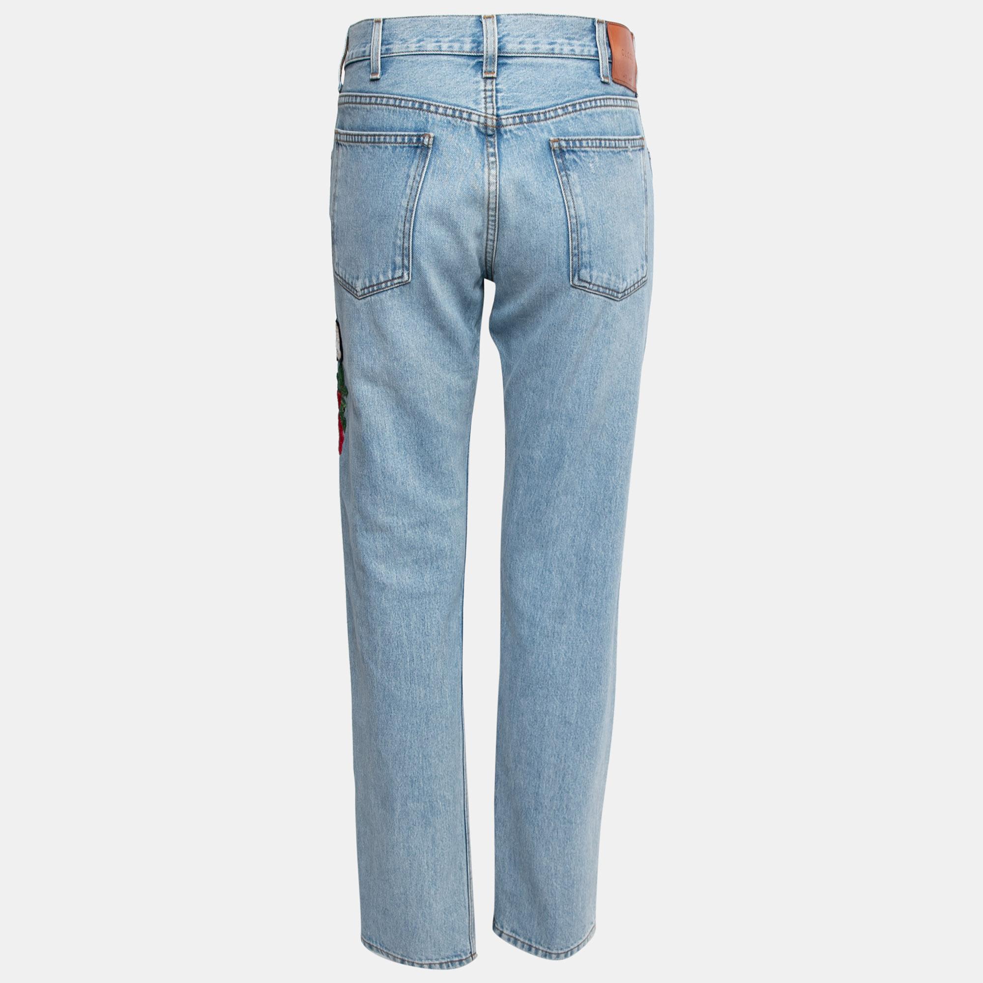 Comfy and classy jeans like these are a closet necessity! These jeans from Gucci are super stylish and chic! They are fashioned in blue denim fabric into a tapered silhouette. They are decorated with floral and Bee embroidery. These jeans are