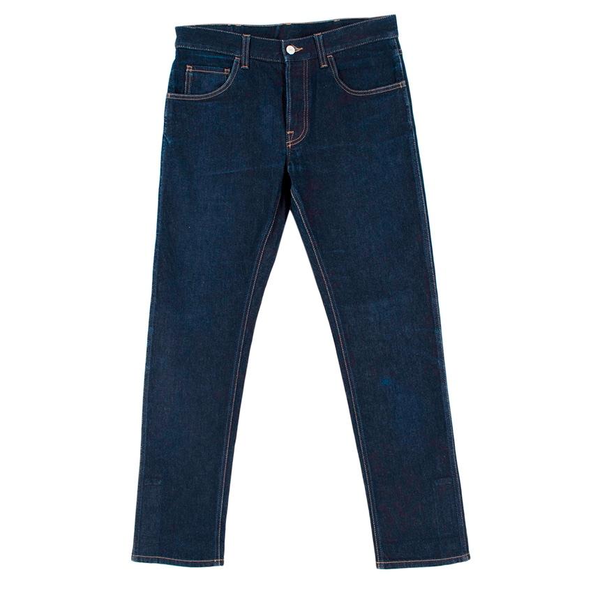 Gucci Blue Denim Web Trim Jeans

- Made of soft cotton denim 
- Iconic web detail to the hems 
- Classic cut 
- 5 pocket style 
- Beautiful, easy to style blue hue 
- Branded leather patch to the back 
-  Button fastening to the front 
- Versatile