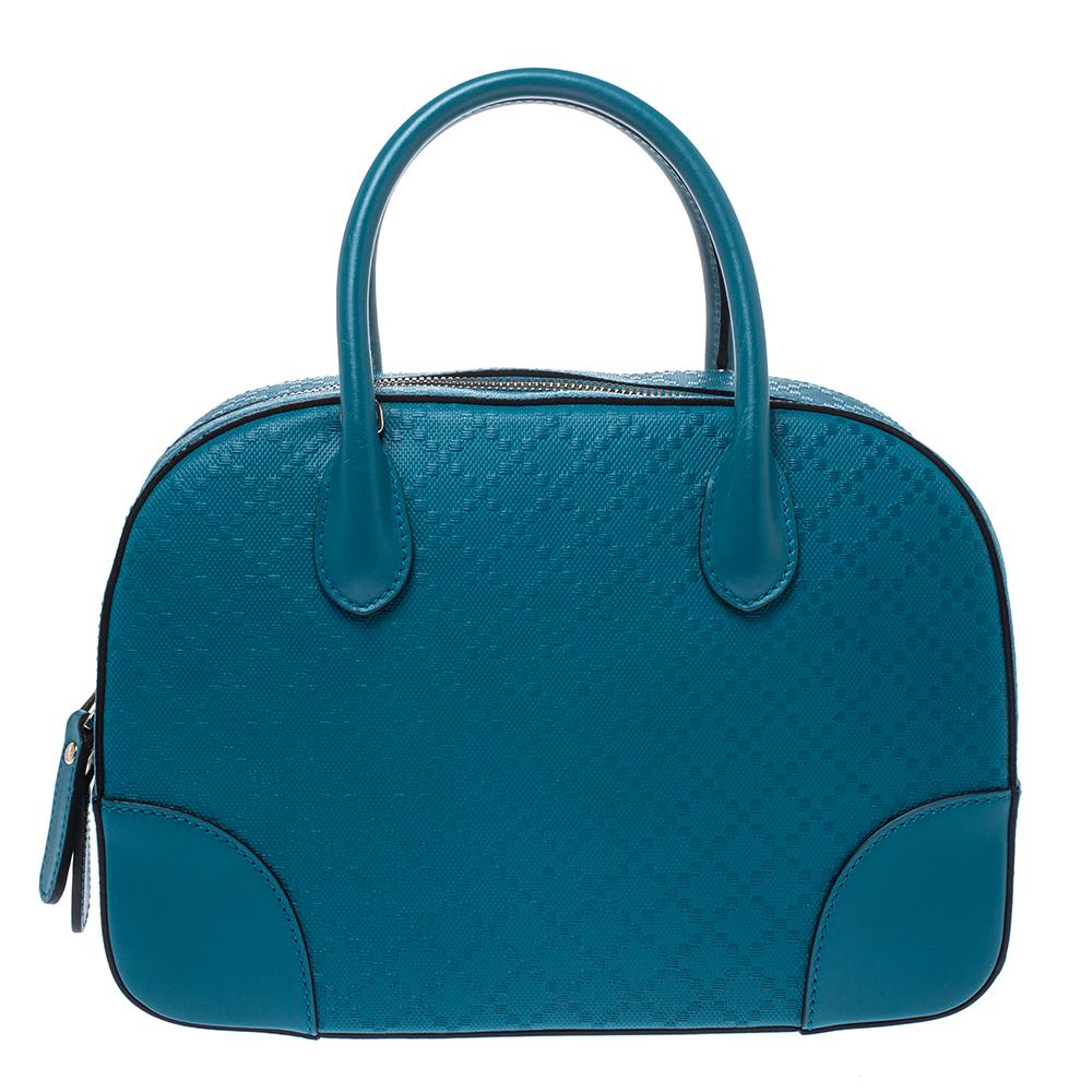 Designed with Diamante leather, this Gucci satchel will look sharp as ever, every time you carry it. Lined with fabric, the interior of this bag is as durable and practical as the exterior. This handbag from Gucci will add a dash of undeniable charm