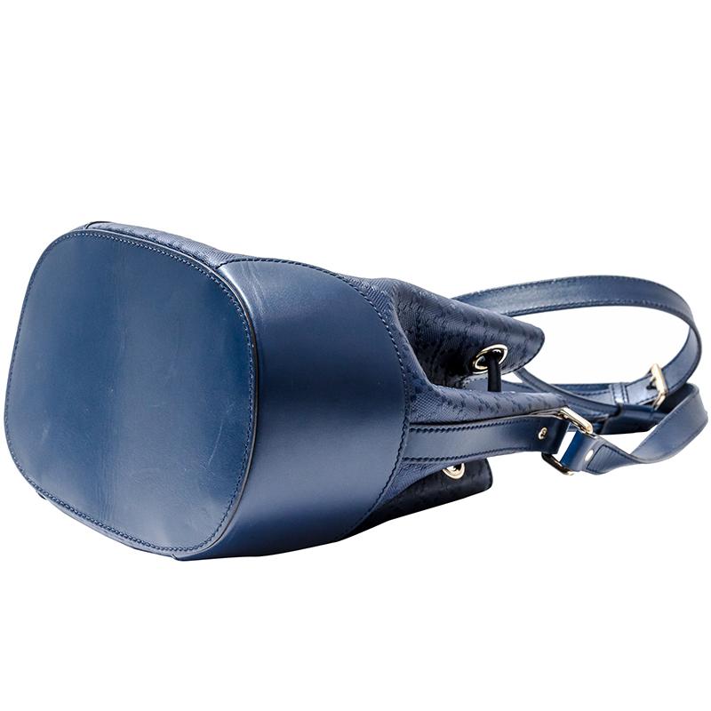 Crafted in a chic bucket silhouette, this Gucci Hilary bag is designed from a chic blue diamante textured leather and secured with a drawstring top closure. It features a slim shoulder strap that can be adjusted to the desired drop. With ample room