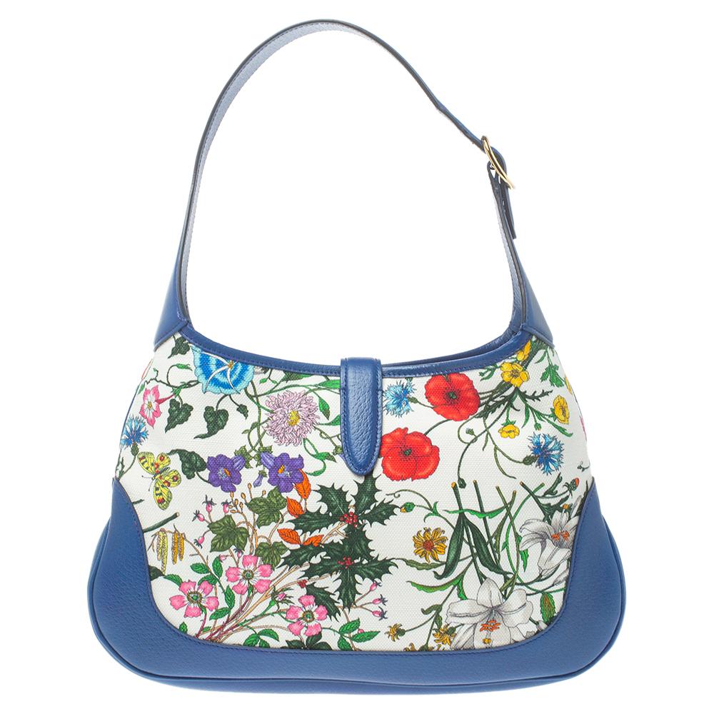 Gucci has always offered a line-up for cult accessories, just like this Jackie hobo originally designed in 1958 as a tribute to Jacqueline Kennedy Onassis. The canvas is printed with colorful blooms, while the contrasting textured-leather edging