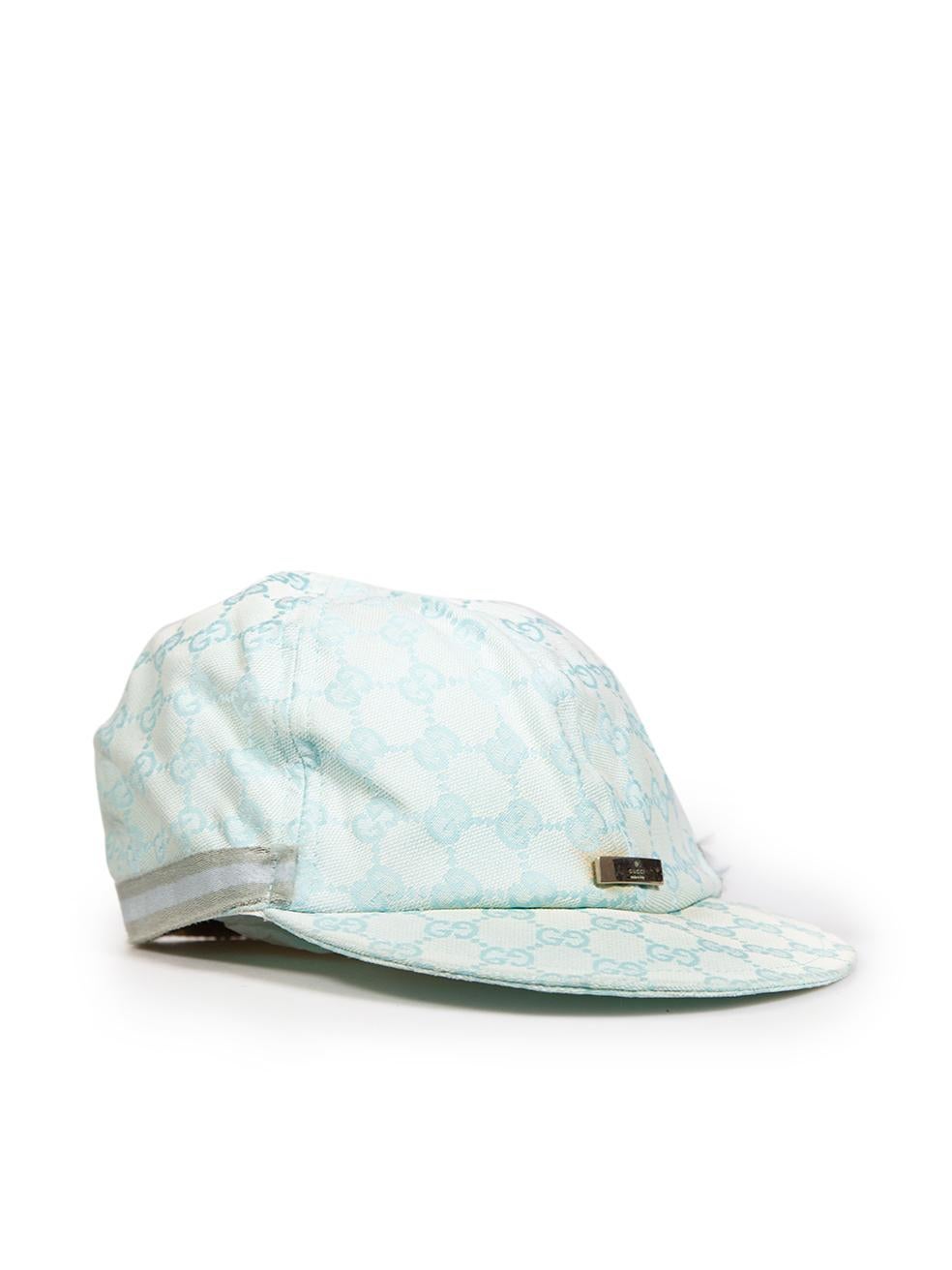 CONDITION is Good. General wear to the cap is evident, the engraved hardware detail is tarnished and has scratches. There is discolouration on the inside of the cap and a mark on the front of the cap. The striped trimming around the cap is frayed at