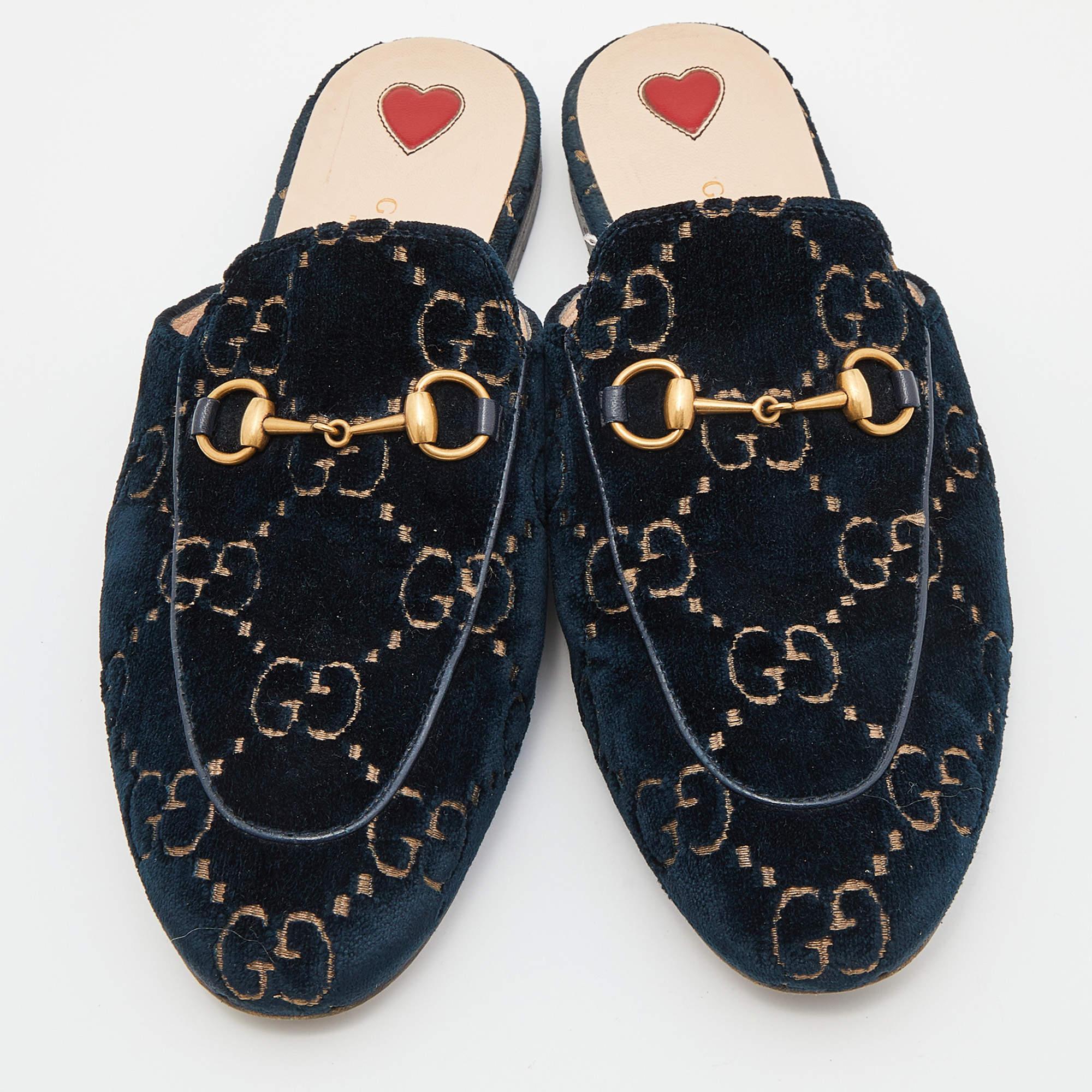 These Gucci Princetown mules signify luxury and practicality. An ultimate favorite of style enthusiasts, its silhouette has the luxe touch of the Horsebit motif on the uppers. It comes made from GG velvet.


