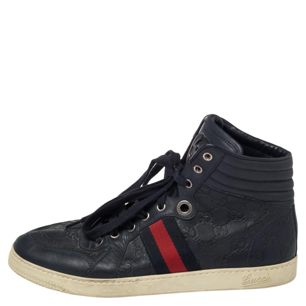 Gucci sneakers are updated in the brand's signature Guccissima leather with web detail. Set on a lightweight rubber sole, this high-top pair is detailed with tonal stitching, web details and silver eyelets. Style yours with rolled jeans or cropped