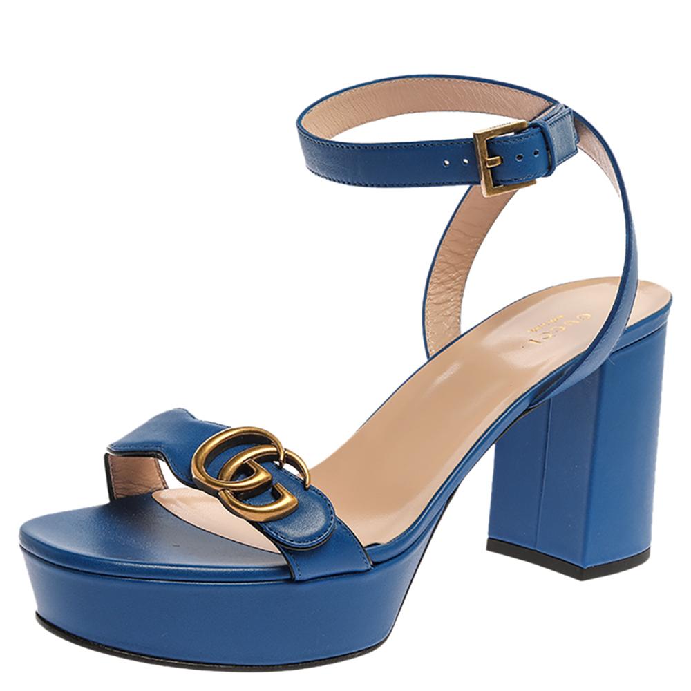 How gorgeous are these GG Marmont sandals from Gucci! Crafted in Italy, they are made from leather and come in a splendid shade of blue. They are styled with open toes, GG logo on the vamp straps, buckled ankle straps, and block heels. These