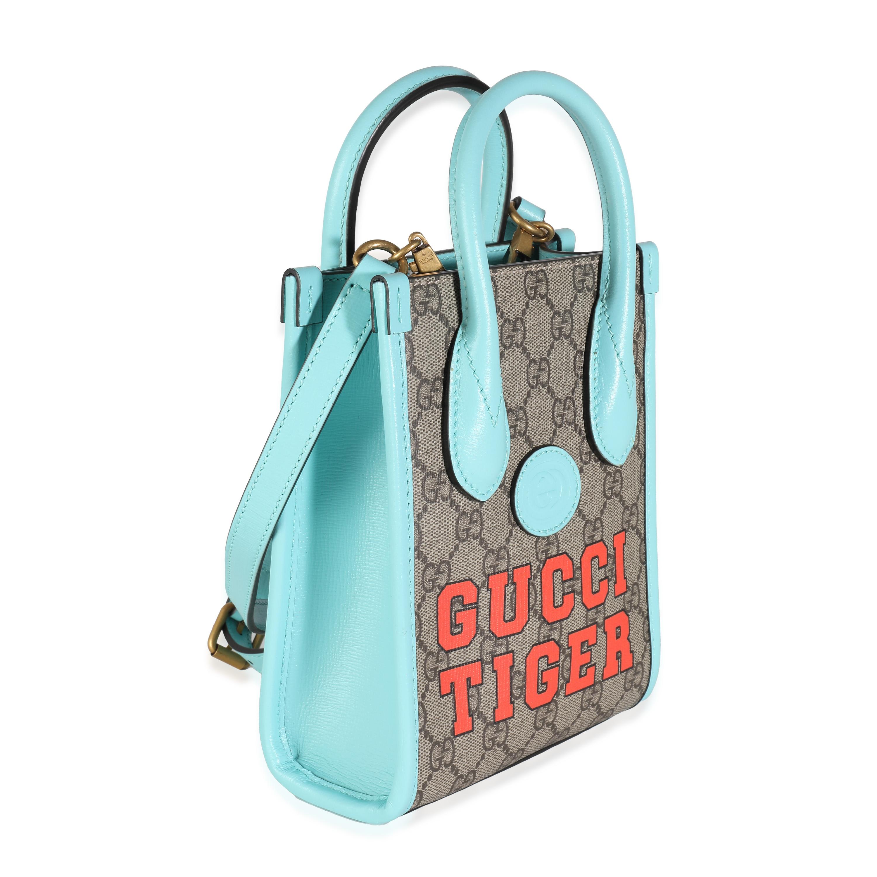 Listing Title: Gucci Blue Leather GG Supreme Canvas Tiger Mini Tote
SKU: 132856
MSRP: 1590.00 USD
Condition: Pre-owned 
Handbag Condition: Pristine
Condition Comments: Item has no indication of wear. No visible signs of wear.
Brand: Gucci
Model: