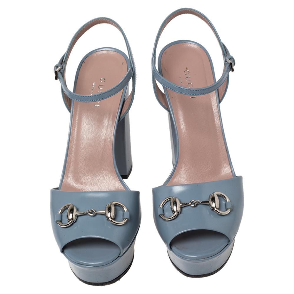 How lovely are these sandals from Gucci! They've been beautifully crafted from leather and styled with Horsebit motifs on the uppers. They carry open-toes, ankle straps, and block heels supported by platforms. Let this pair lift your outfits by