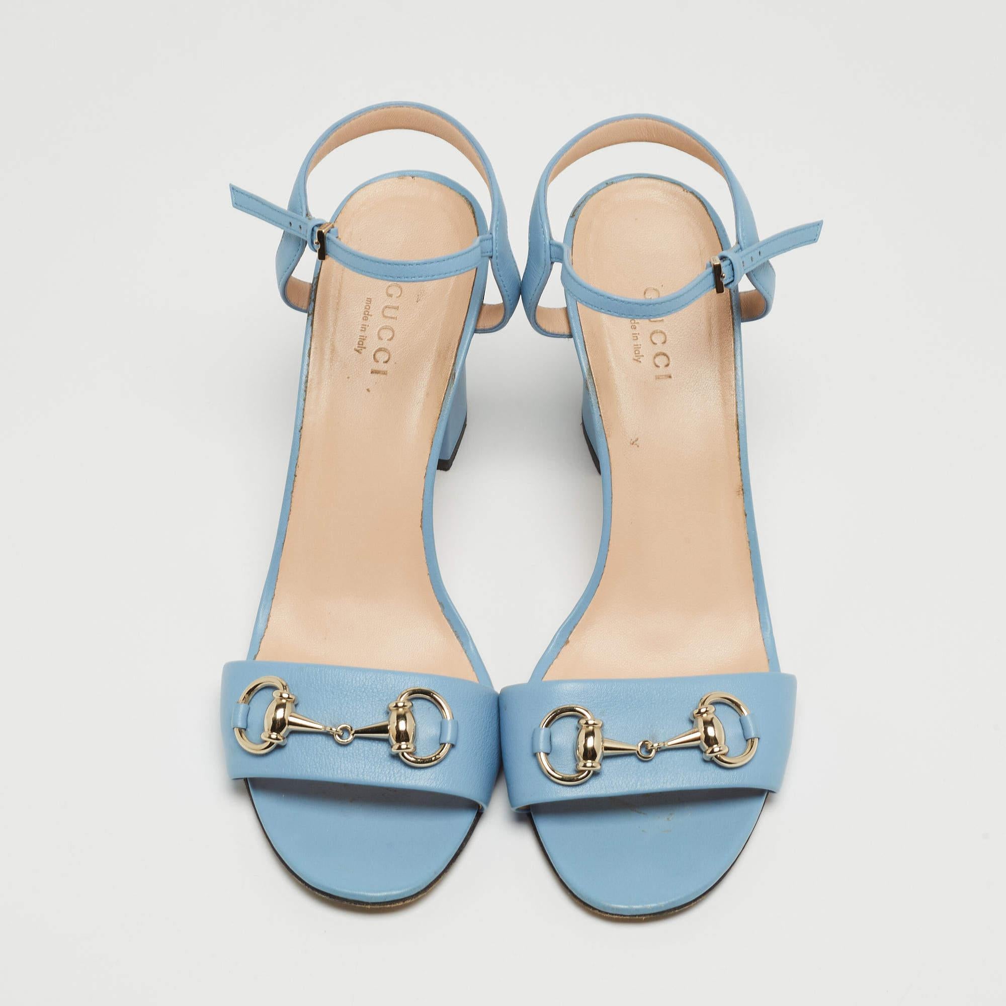Crafted with supple blue leather, they feature the iconic horsebit detail on the front, a slender ankle strap for support, and a block heel. These Gucci sandals exude elegance and sophistication, making them a perfect choice for any stylish