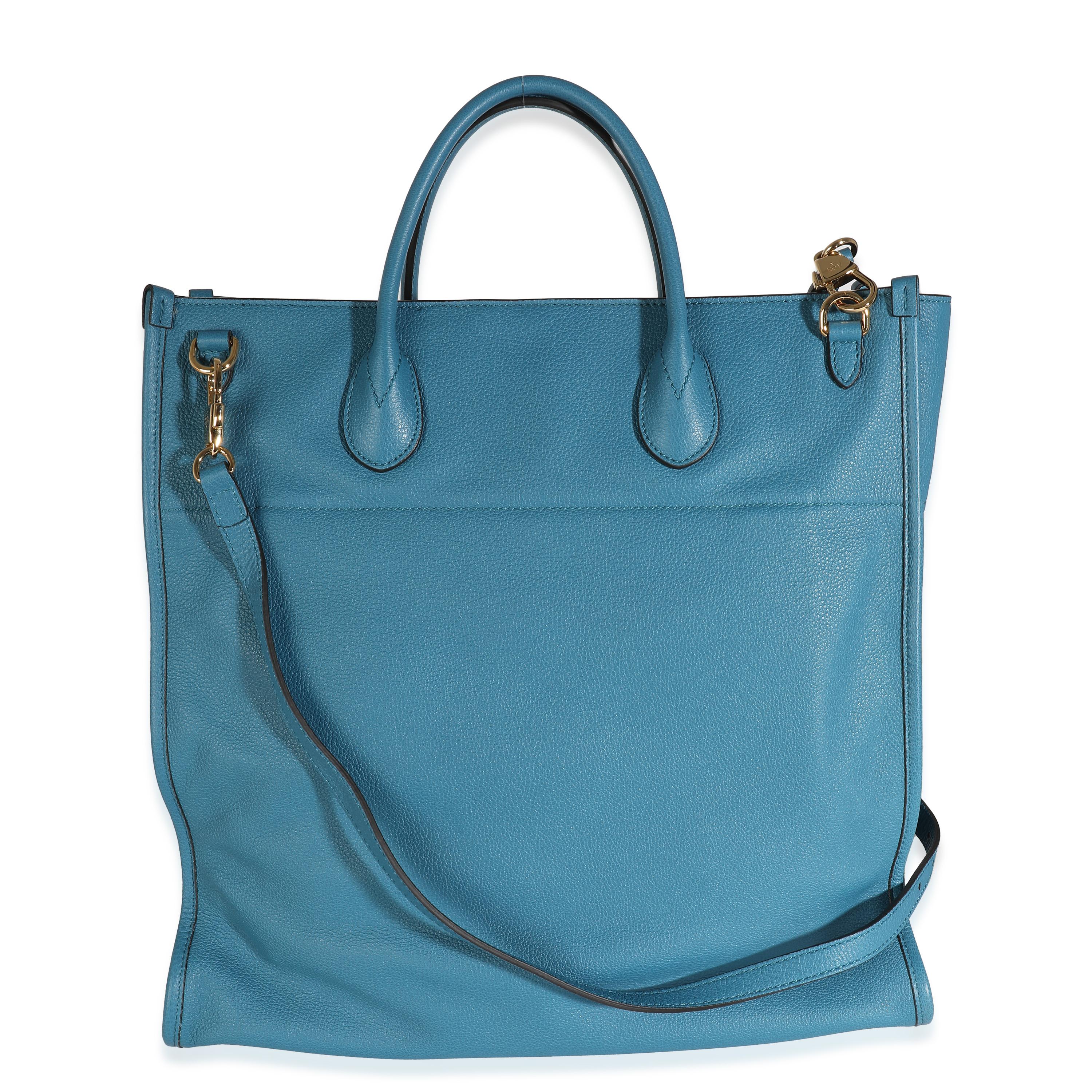 Listing Title: Gucci Blue Leather Logo Embossed Shopper Tote
SKU: 132973
Condition: Pre-owned 
Condition Description: The green and red Gucci Web was created in 1964 and has since been considered a recognizable signature of the house. This belt bag