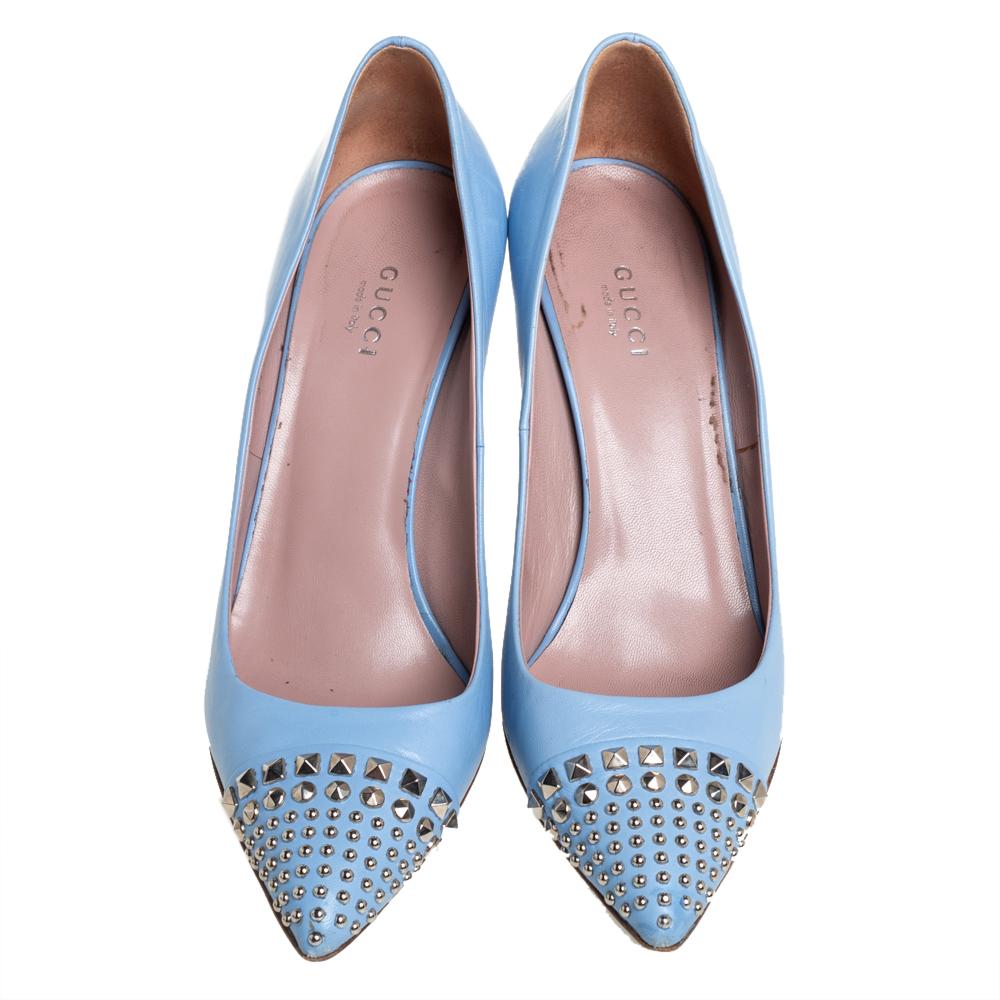 Look chic and make an elegant style statement in this pair of pumps from the house of Gucci. They are crafted from leather featuring stud embellishments on the pointed toes, high heels, and a stunning shade of blue. Add a touch of sophistication to
