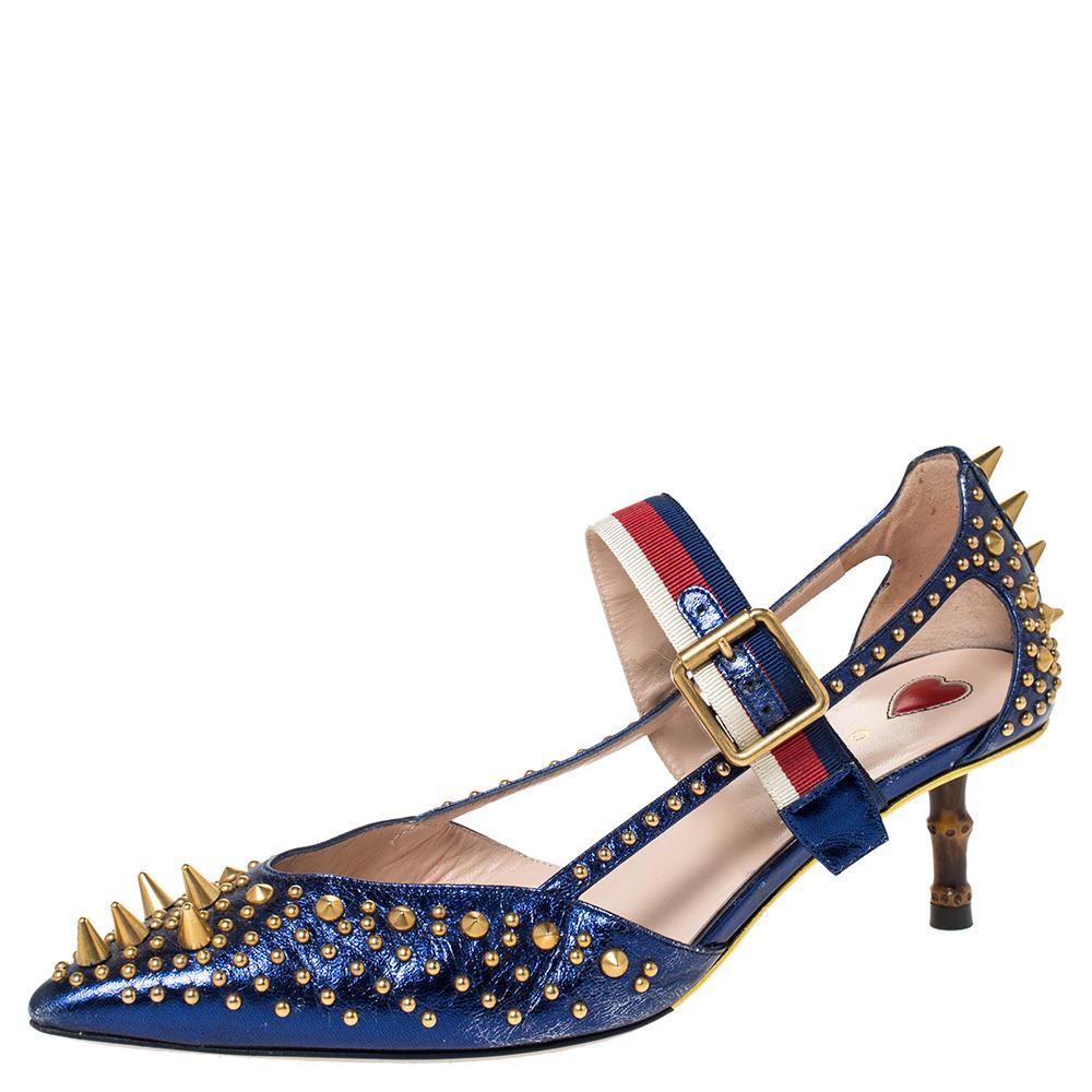 These pointed-toe Unia pumps from Gucci have come straight from a shoe lover's dream. Crafted from blue leather, detailed with gold-tone studs all over along with signature Web straps on the ankle and are balanced on short bamboo heels. The pumps