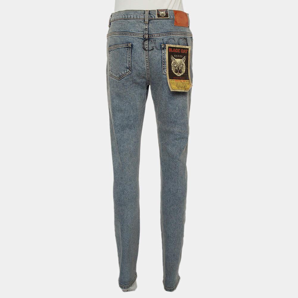 Now style those fabulous T-shirts of yours with these amazing blue denim jeans from Gucci. They feature a skinny silhouette with a muddy effect and come equipped with a logo print at the back, a front button and zip fly, belt loops, and five