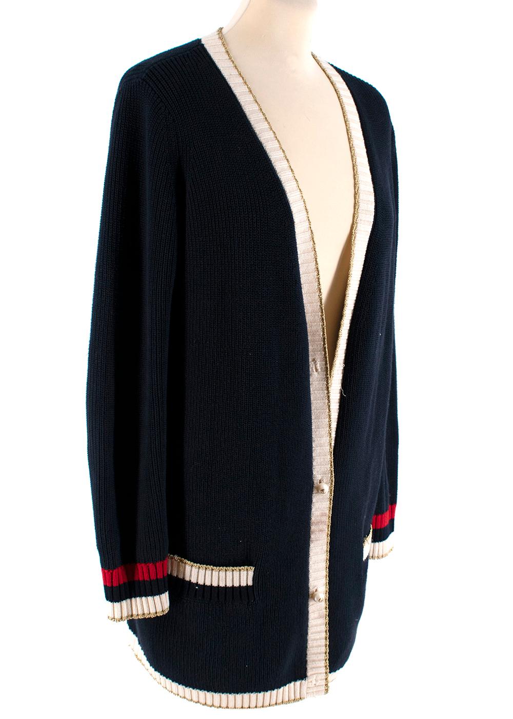 Gucci Blue Cotton Contrasting Trims Knit Cardigan

- Made of soft cotton knit
- Classic cut 
- Faux pearl button fastening to the front 
- GG logo to the buttons
- 2 pockets to the front 
- Embroidery detail to the back 
- V-neck 
- Contrasting