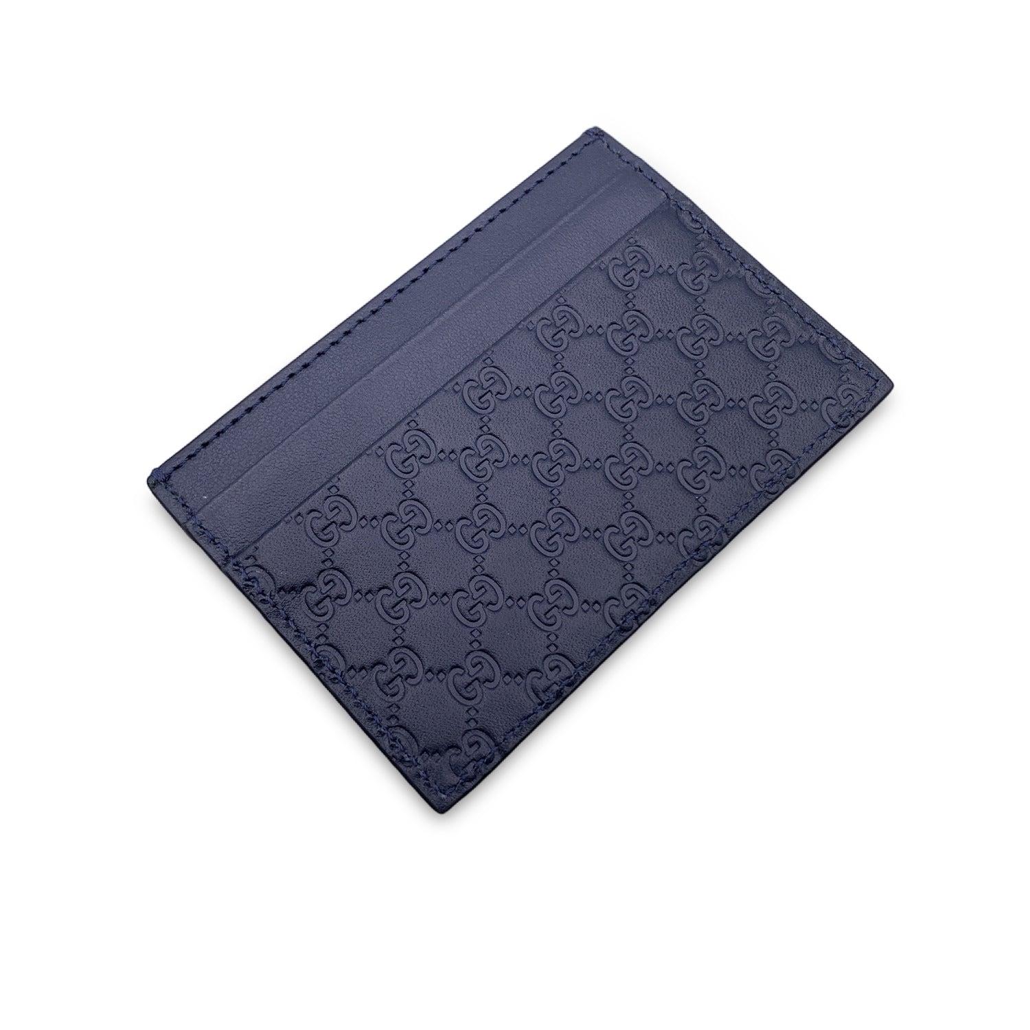 Beautiful Gucci credit card holder wallet, crafted in blue microguccissim leather. Leather interior. 1 middle open section and 4 credit card slots. 'Gucci - Made in Italy' and serial number engraved inside. Details MATERIAL: Leather COLOR: Blue