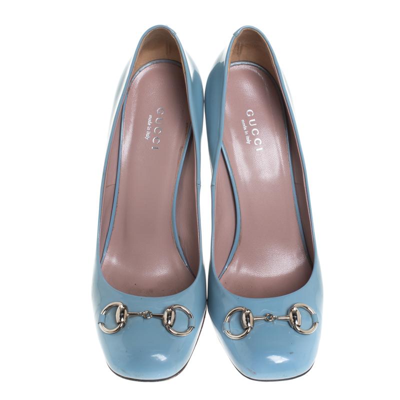Featuring a chic, minimalist design, these Jolene pumps from Gucci are easy to style. Blue patent leather uppers showcase silver-tone signature Gucci horsebit accents on the vamps. High stiletto heels and square toes form a distinctive outline.