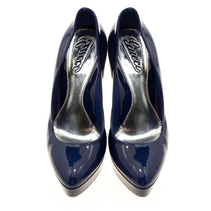Lovely in blue, these pumps from Gucci deserve a very special place in your wardrobe! They are crafted from patent leather and feature almond toes. They come equipped with comfortable leather lined insoles, 12.5 cm heels and platforms that offer