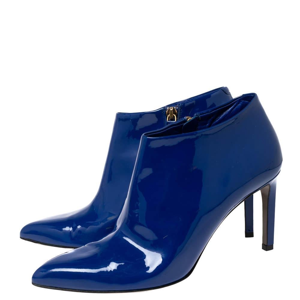 The house of Gucci promises to elevate your style with this fabulous pair of booties. Casual Fridays will look so much better at work thanks to these patent leather booties. They feature pointed toes, zippers on the side and are balanced on 8 cm