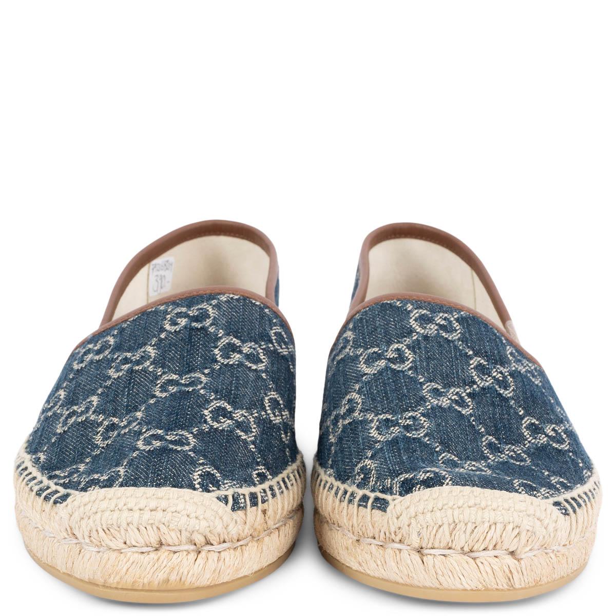 100% authentic Gucci Pilar slip on espadrilles in navy blue and ivory GG Supreme eco-washed organic jacquard denim. Features brown leather trim, braided jute detail at sole edge and rubber soles. Brand new. Come with dust bag.