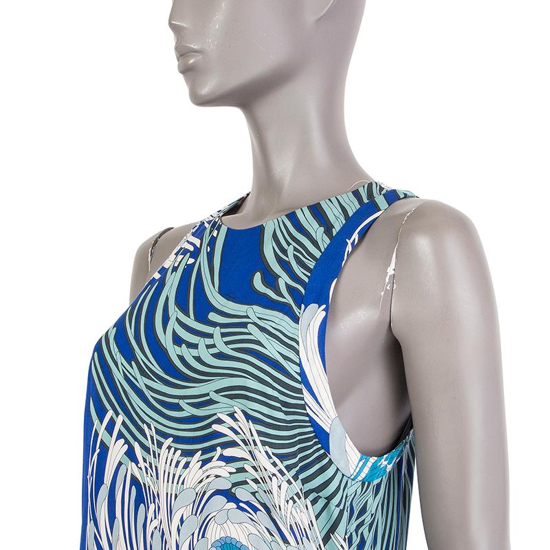 Gucci sleeveless floral shift dress in royal blue, aqua, cyan, baby blue, and white silk (100%). With wide racer back.. Closes with invisible zipper on the back. Lined in cream silk (96%) and elastane (4%). Has been worn and is in excellent