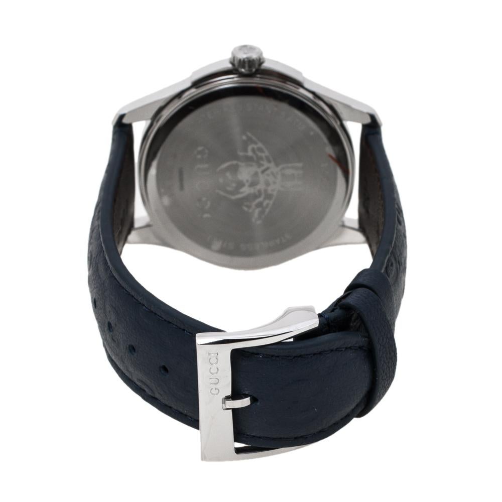 Gucci brings you this smart stainless steel timepiece for you to flaunt on your wrist. Swiss made, it follows a quartz movement and carries a blue GG-embossed leather dial. The dial flaunts the house's signature bee motif and the brand label in