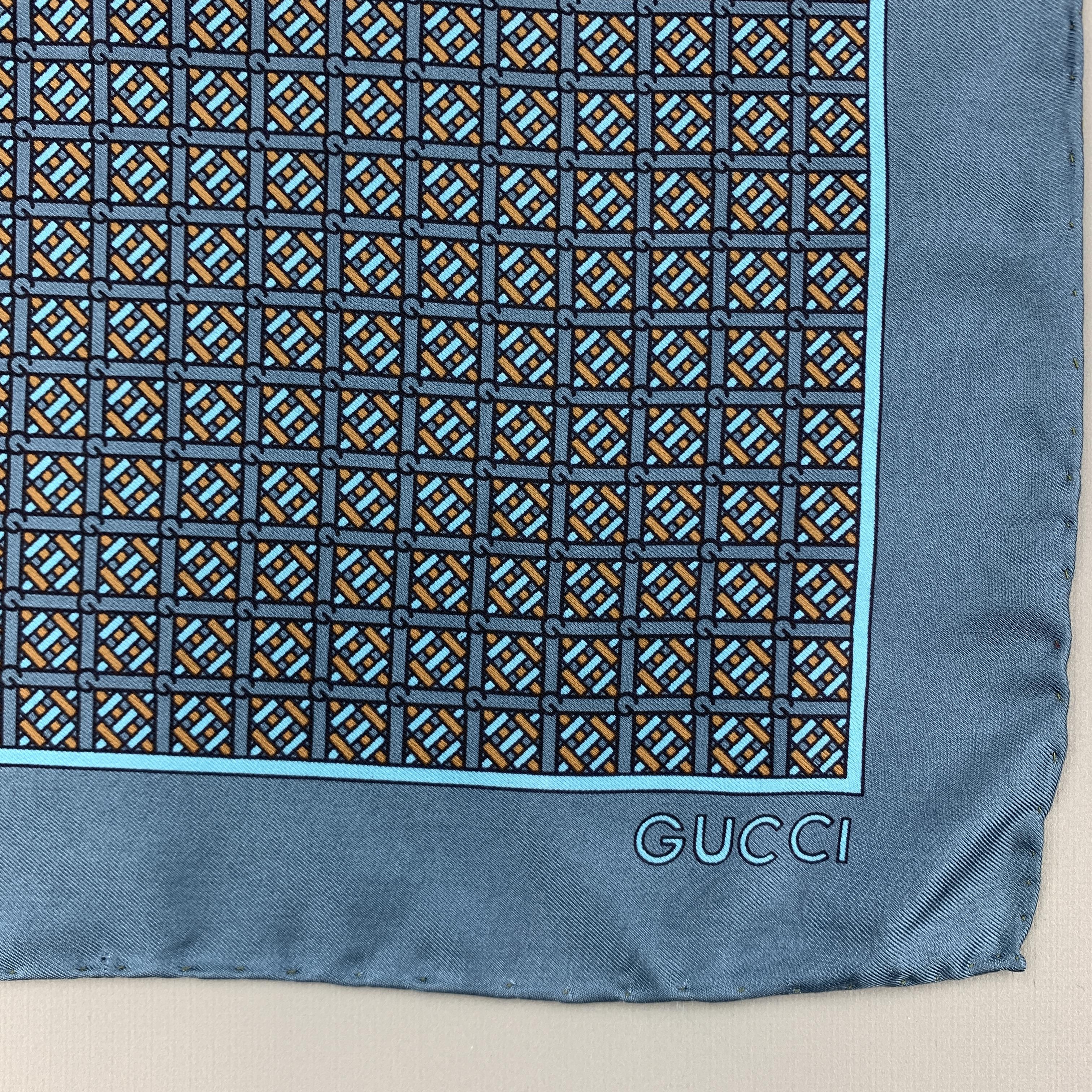 Vintage GUCCI pocket square comes in muted blue silk twill with an all over navy and taupe interlock G monogram pattern. Minor wear. As-is. Made in Italy.

Good Pre-Owned Condition.

16.25 x 16.75 in.