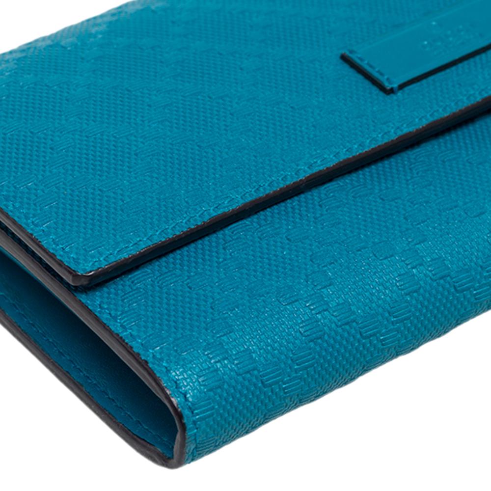 Made using Diamante leather, this continental wallet from Gucci has a simple look and functional quality. The flap opens to a sleek interior featuring a lined compartment housing a zip pocket and card slots.

Includes: Original Dustbag, Original