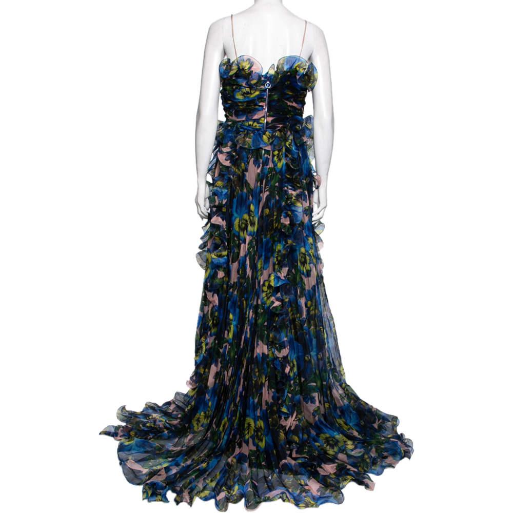 The house of Gucci presents to you this beautiful printed blue dress that has been exquisitely crafted from silk. The sleeveless maxi dress features ruffle trims all over and a flowy, feminine silhouette that will make you feel truly luxurious. Pair