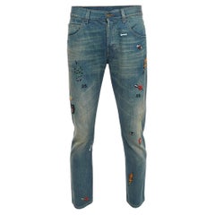 Blau gewaschene und bestickte Denim-Jeans von Gucci mit L-Taille 34"