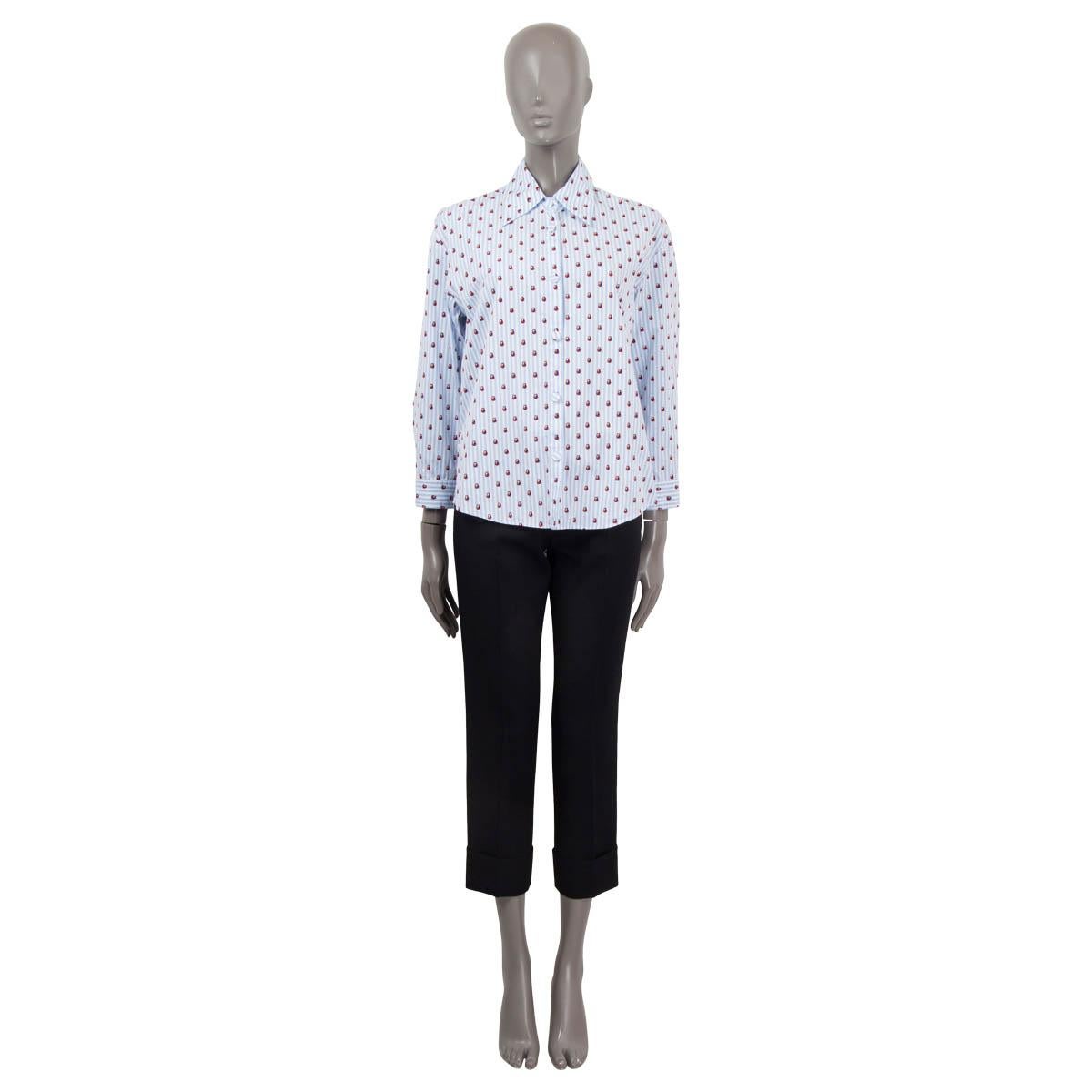 100% authentic Gucci ladybug button-up shirt in blue and white stripped cotton poplin (100%) and details in red and black. Features buttoned cuffs and a point collar. Closes with fabric covered buttons. Unlined. Has been worn and is in excellent