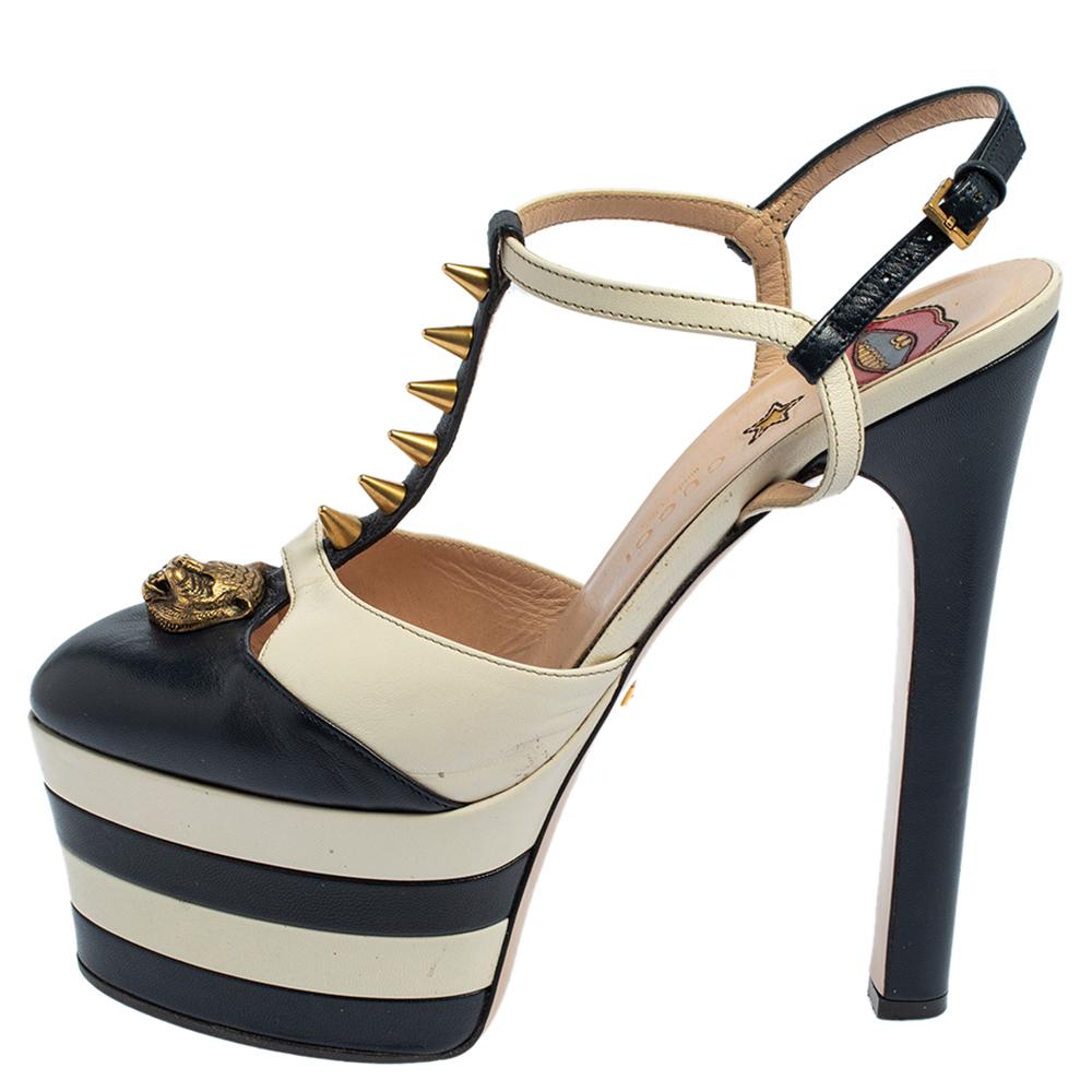 Add the bold Gucci aesthetic to your style with these platform sandals. They come crafted from leather into a stunning silhouette and are detailed with gold-tone embellishments and buckle fastening. The platforms and 15 cm heels give the pair a