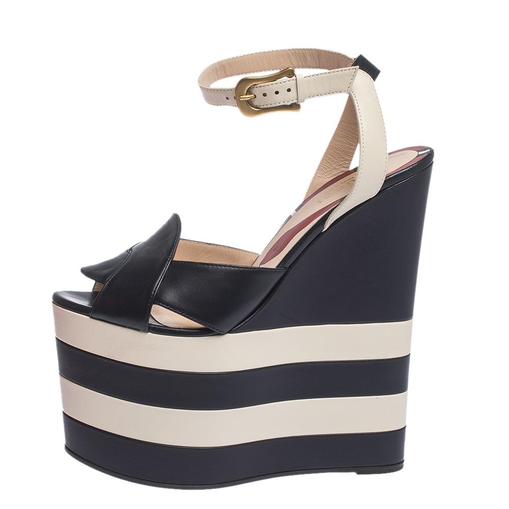 These sandals from the house of Gucci are not only high on appeal but also very skilfully made. Exuding modern style, they come crafted from leather and feature ankle straps, open toes and high wedge heels. They are complete with 17 cm striped