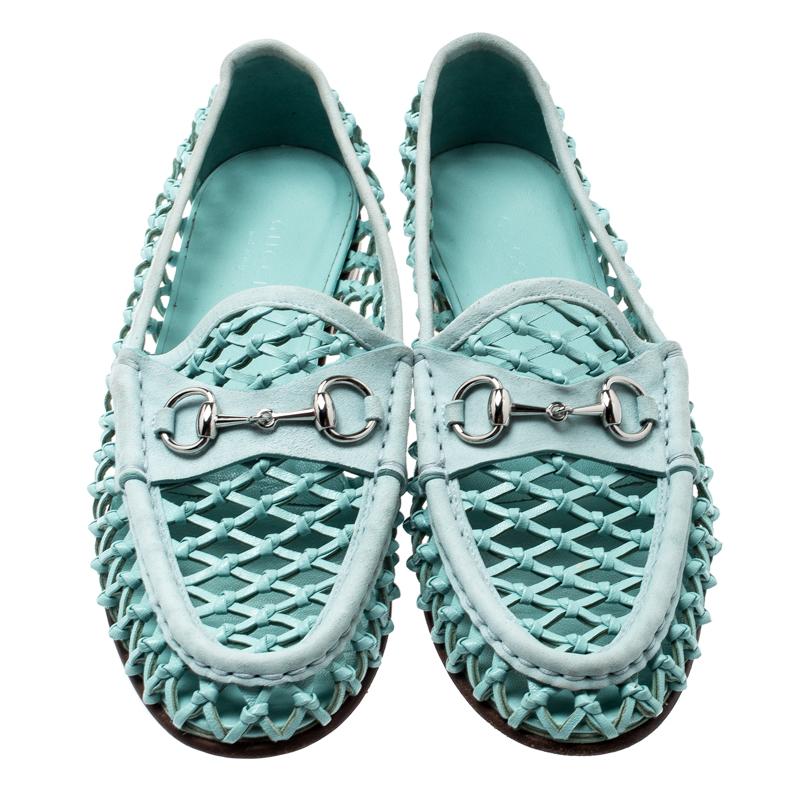 For a look that is sure to create a trend amongst the daring fashion lovers, these Gucci loafers will be a wise buy. Crafted in blue woven leather with a see-through weaving, these loafers feature the signature horsebit detailing on the vamps for