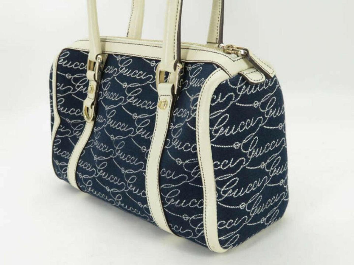 Material CANVAS x LEATHER
 Color BLUE x IVORY
 Approximate SizeWx28cm(11inch) Hx15cm(5.9inch) Dx7cm(2.8inch)
 Handle Drop / Strap DropHanle Drop : 17cm(6.7inch) / Strap Lengh : -
 
 
 Stamp / Serial Number 130942 002058
 Country of Manufacture