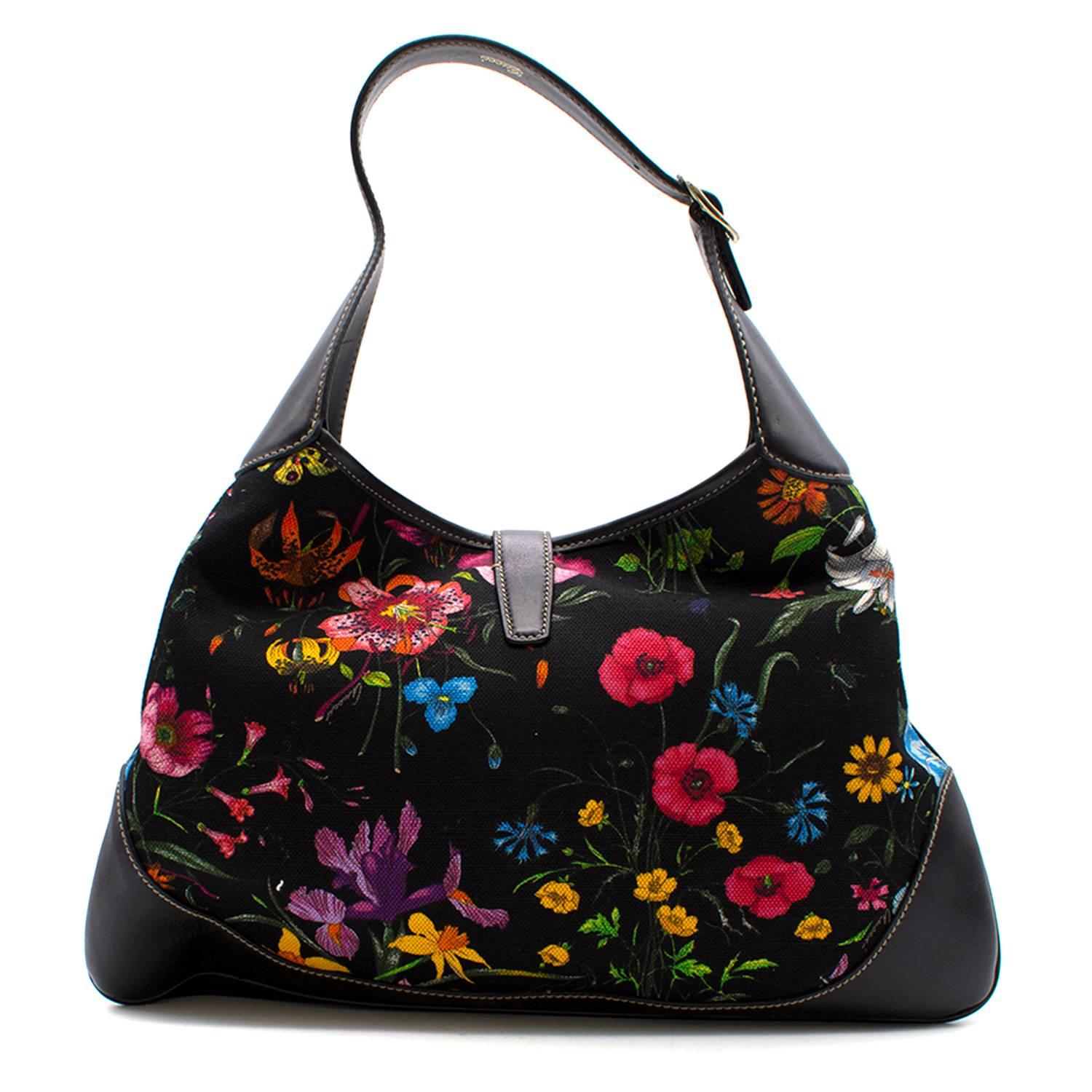 Gucci Botanical Black Floral Canvas Jackie O Bouvier Bag

- Adjustable buckle strap
- Push-lock closure
- Interior zip pocket and phone pocket
- Includes original dust bag

Condition: 9.5/10
Measurements: Approx: Length - 39cm Width - 22cm Strap