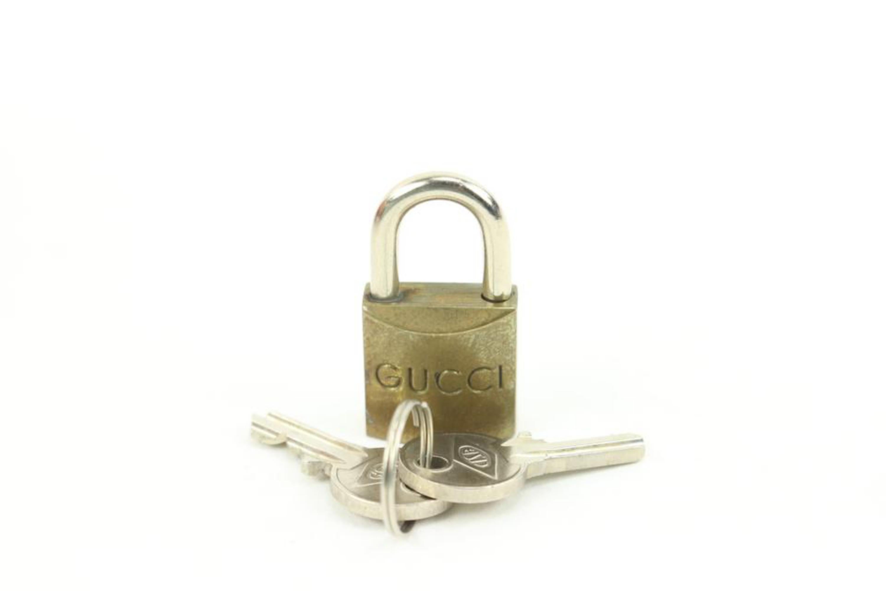 Gucci Messing GG Schloss und Schlüssel Vorhängeschloss Tasche Charme Cadena 11g222s für Damen oder Herren im Angebot