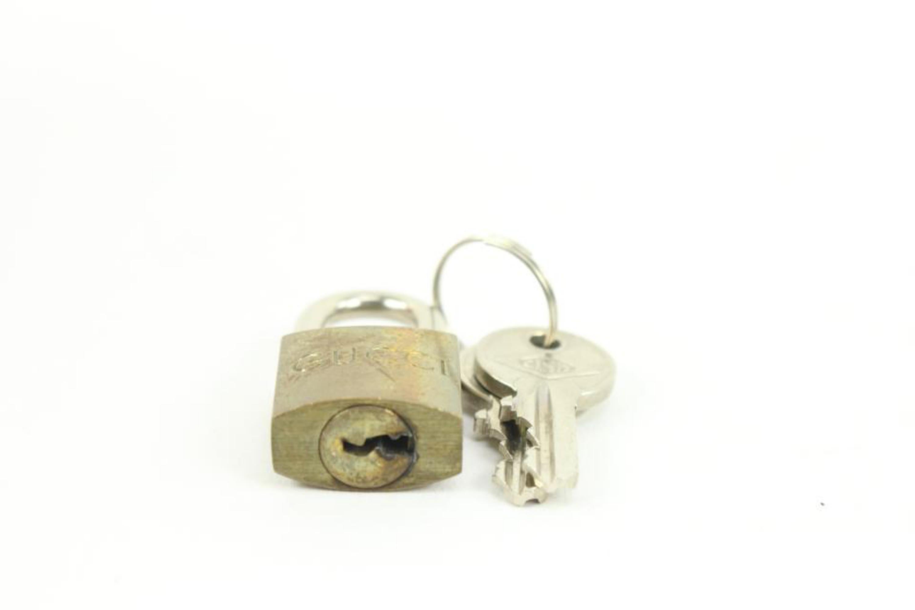 Gucci Brass GG Lock and Key Padlock Bag Charm Cadena 11g222s In Fair Condition For Sale In Dix hills, NY