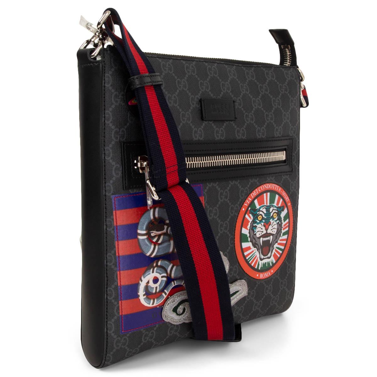 100% authentic Gucci Night Courrier GG Supreme Messenger shoulder bag in black and grey coated GG canvas and black leather trimming. Fastened with a zipper on top. Zip pocket and colourful patches at front. Adjustable shoulder strap with signature