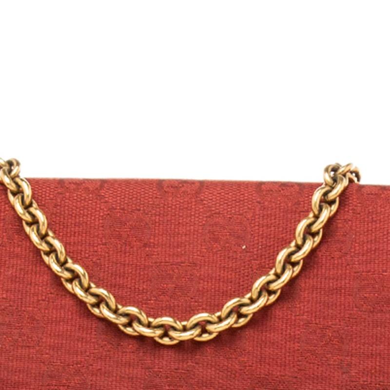 Complete a stylish look with this beautiful Gucci chain clutch. It is made from classic GG canvas and it has the Horsebit accent in gold-tone metal on the front. The flap closure opens to a lined interior, perfect to hold your phone, card case,