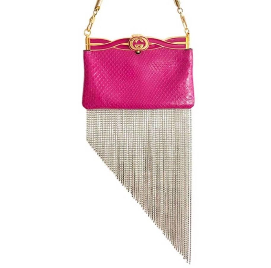 SOLD OUT GUCCI Broadway crystal fringed water snake pink print leather clutch, a sparkling rendition of Gucci's vintage-inspired leanings, this black water snake Broadway clutch is adorned with swaying crystal fringing along the base. It is crafted