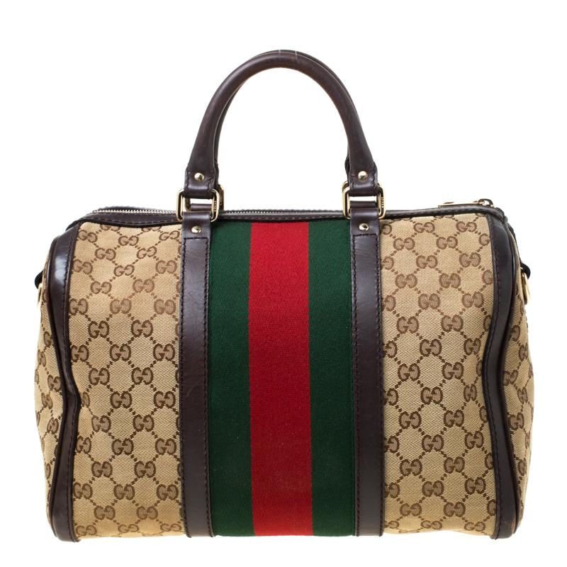 This Gucci Boston bag perfectly blends Gucci’s timeless and iconic style. This satchel is made from Gucci’s classic GG canvas, with a brown leather trim that gives it a luxurious touch. It features the signature web detail stripes, gold-tone