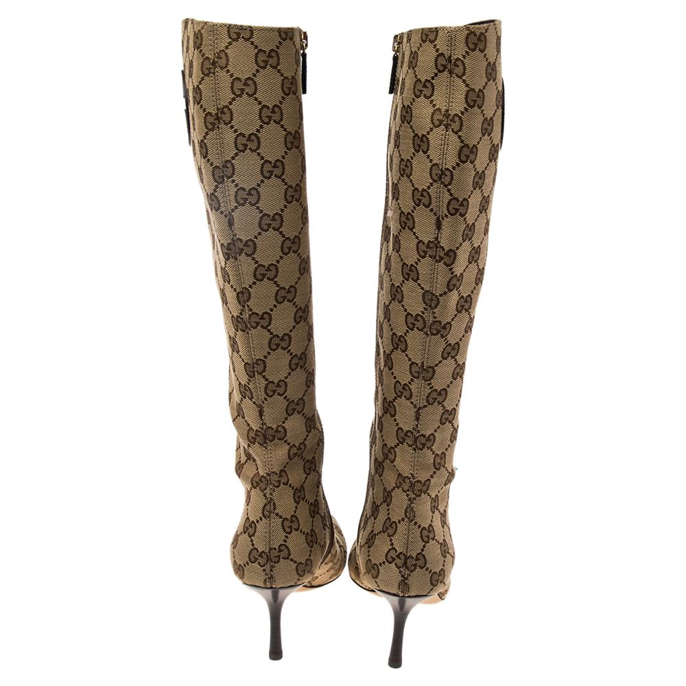 Crate the ultimate Gucci 'logomania' look with these boots. Crafted from GG canvas, the mid-calf boots are truly Gucci — classy, eye-catching, luxurious. They bring covered toes, side zippers, and slim heels.

Includes: Original Box