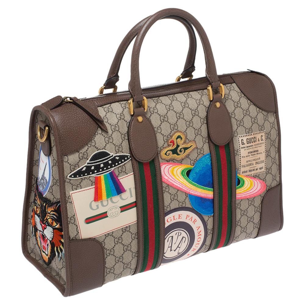 gucci supreme duffle bag