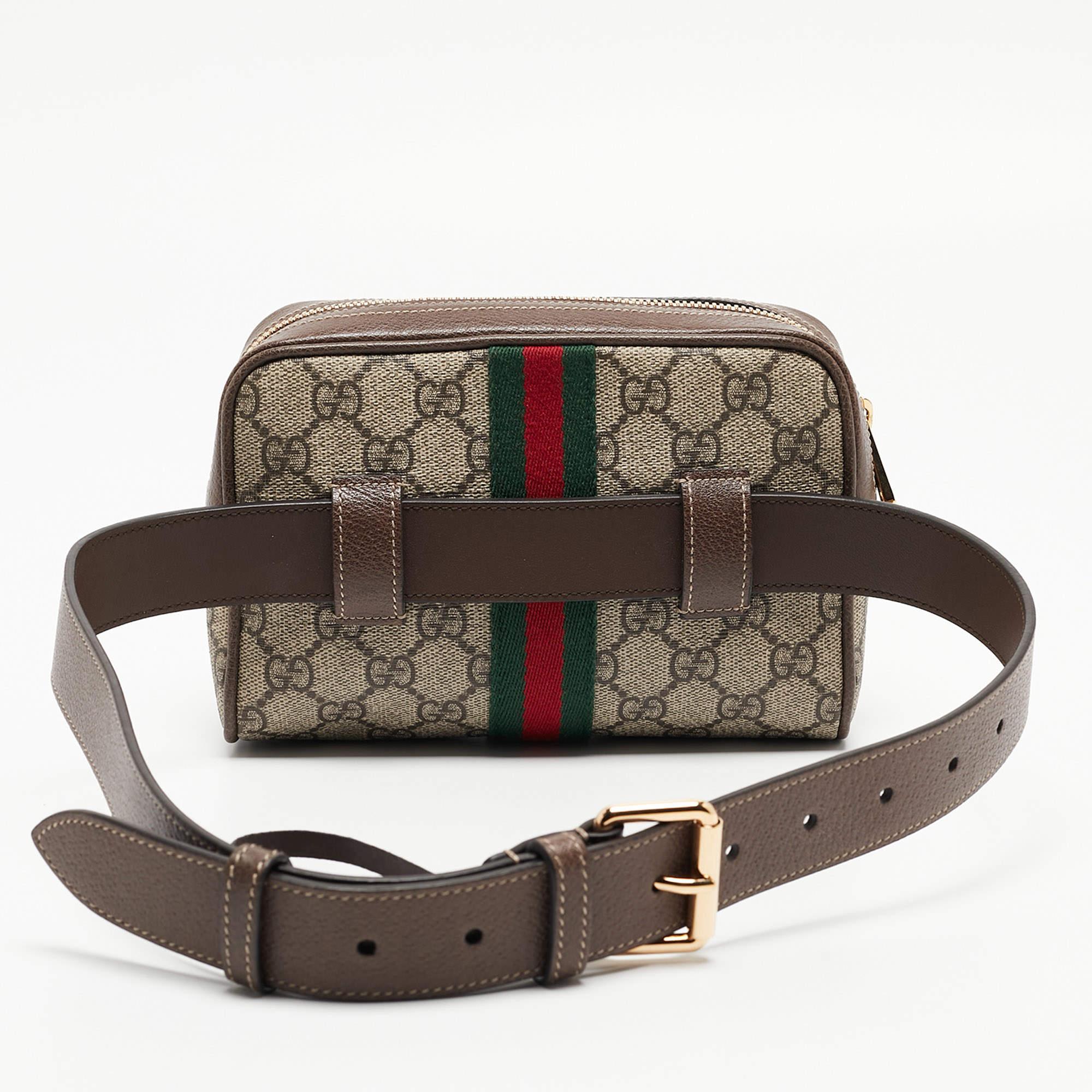 Every creation from Gucci is noteworthy for its timeless charm and versatile design. Created from GG Supreme canvas and leather, this Gucci Ophidia belt bag is imbued with heritage details. The Web stripe detailing and the branded motif on the front