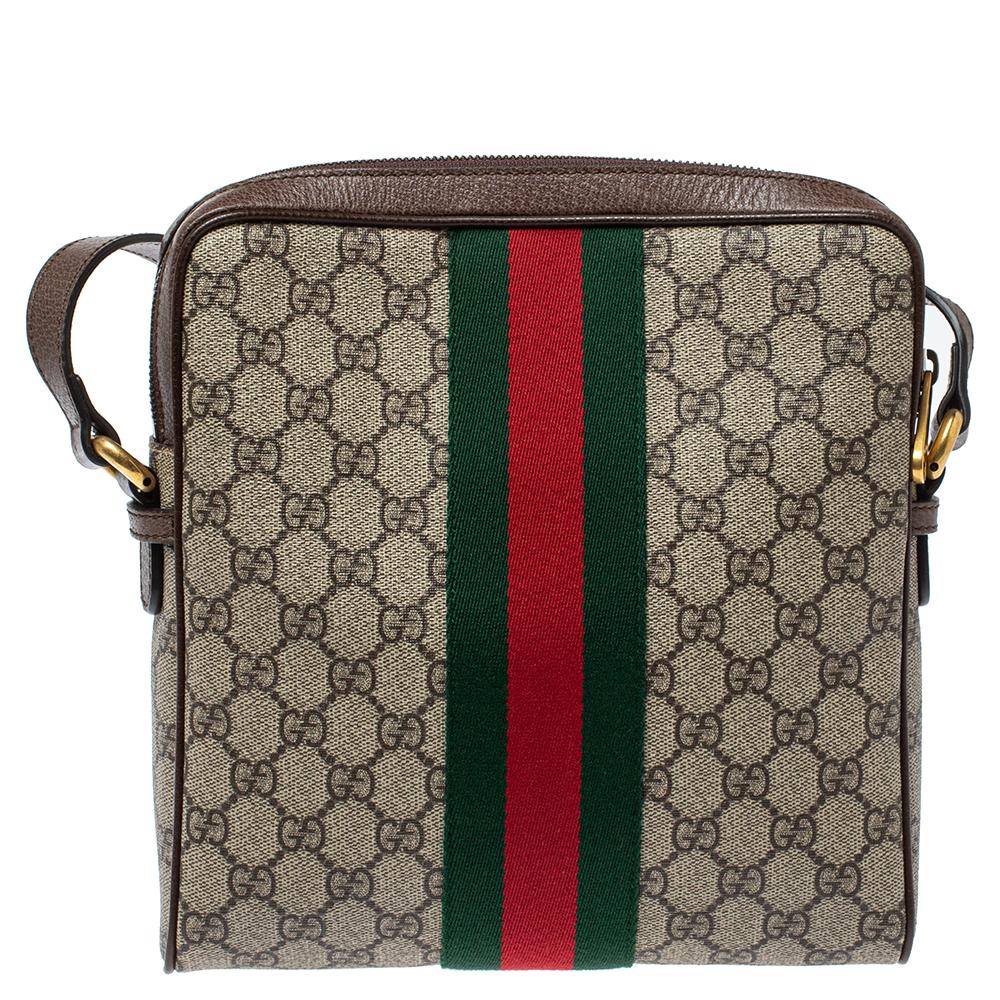 Add to your look by accessorizing with this Gucci messenger bag. Designed expertly, this bag features a GG Supreme coated canvas body that is enhanced with leather trims. The bag flaunts the signature GG on the front along with the web detailing. It