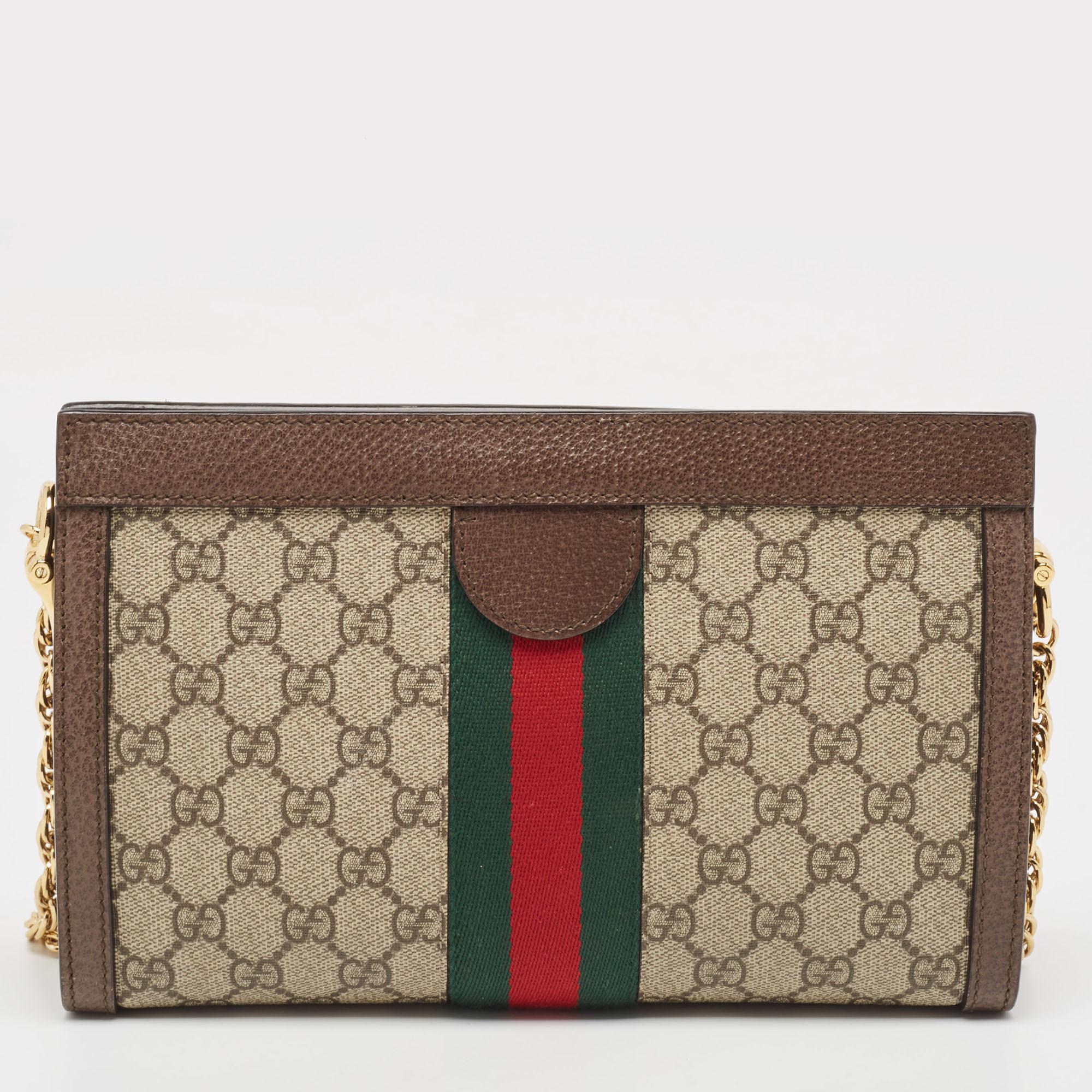 Every creation from Gucci is noteworthy for its timeless charm and versatile design. Created from GG Supreme canvas, this Gucci Ophidia bag is imbued with heritage details. The Web stripe detailing and the interlocked 'GG' motif on the front give it