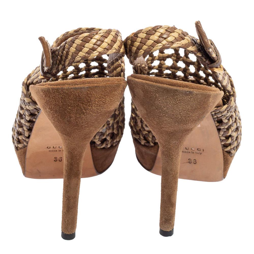 How pretty are these sandals from the House of Gucci! They are designed using beige-brown woven leather and showcase a slingback, peep-toes, and platforms. For a classy effect, they are elevated with 13.5 cm heels and gold-tone hardware. Look